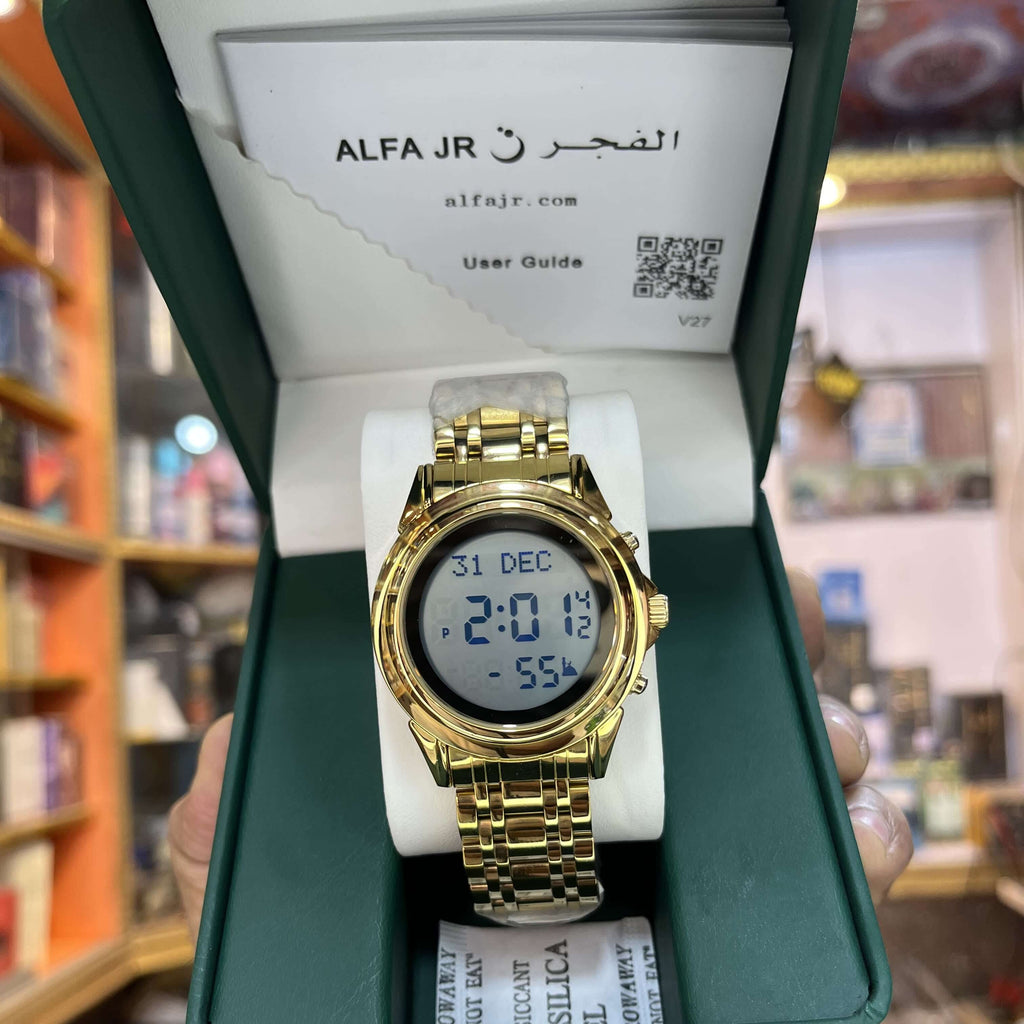 Gold digital watch in a green box