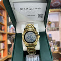 Gold digital watch in a green box