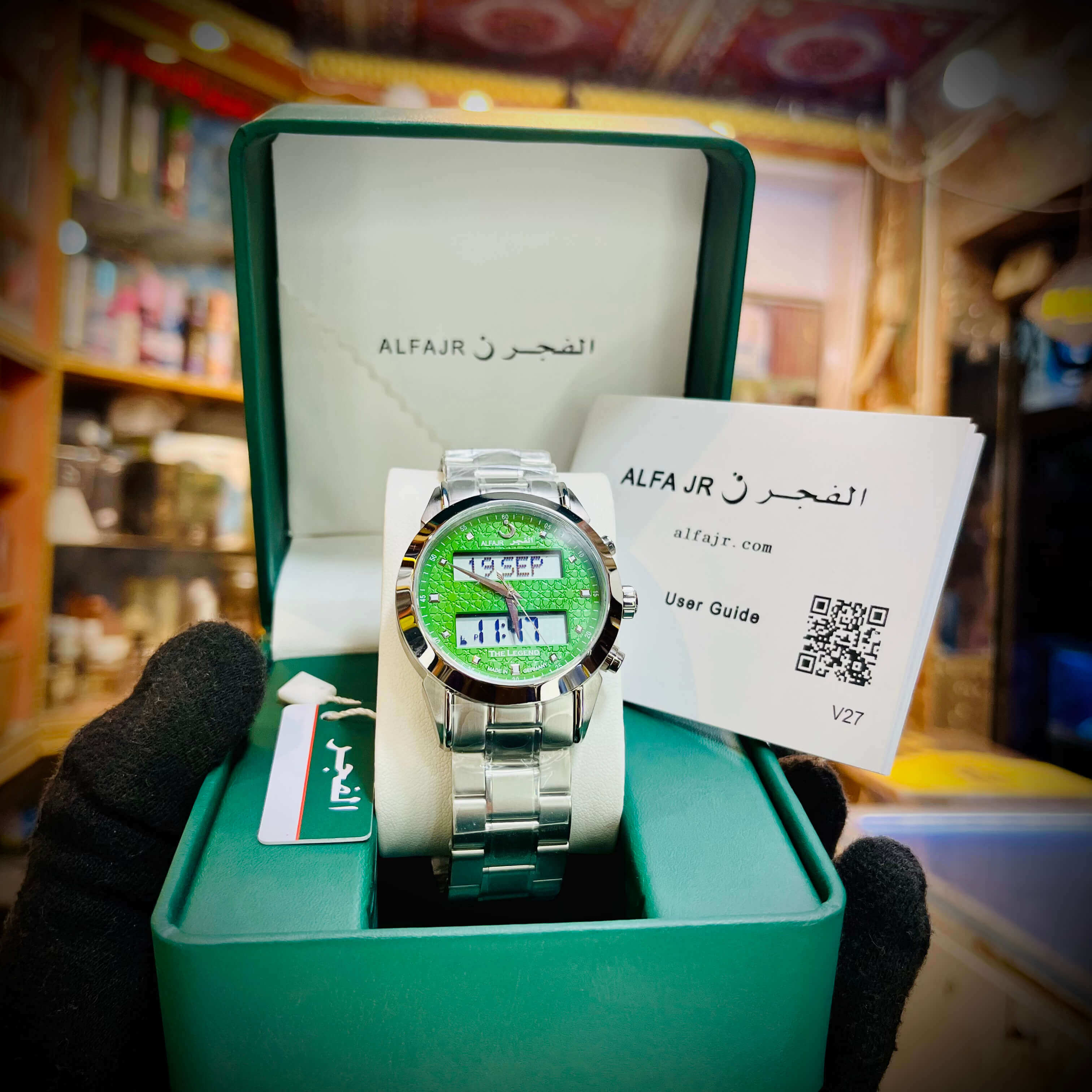 Green digital watch in a green box with ALFAJR branding
