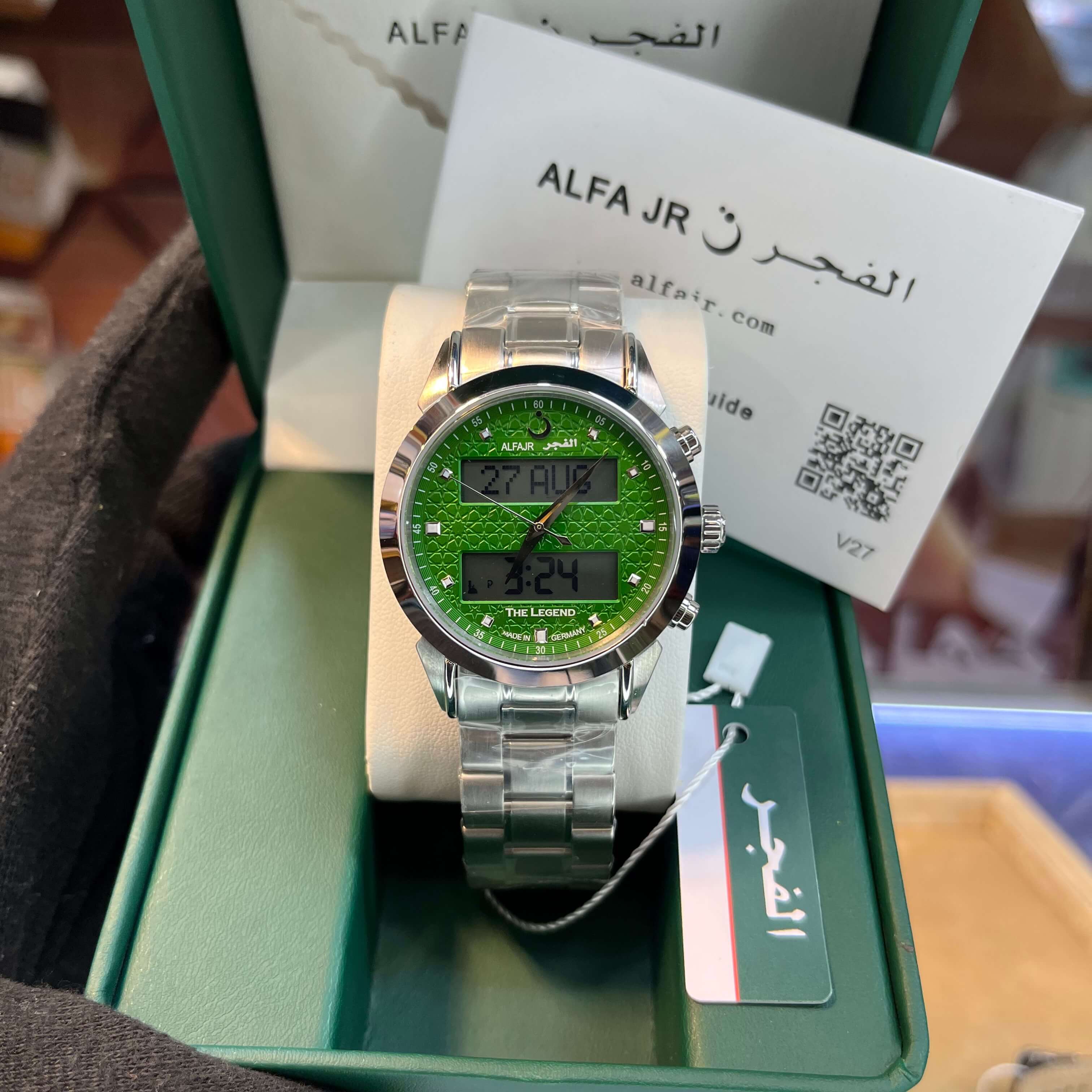 Green watch with digital display on a green box,